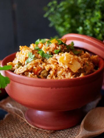 Top view of terracotta bowl with chettinad veg biryani.