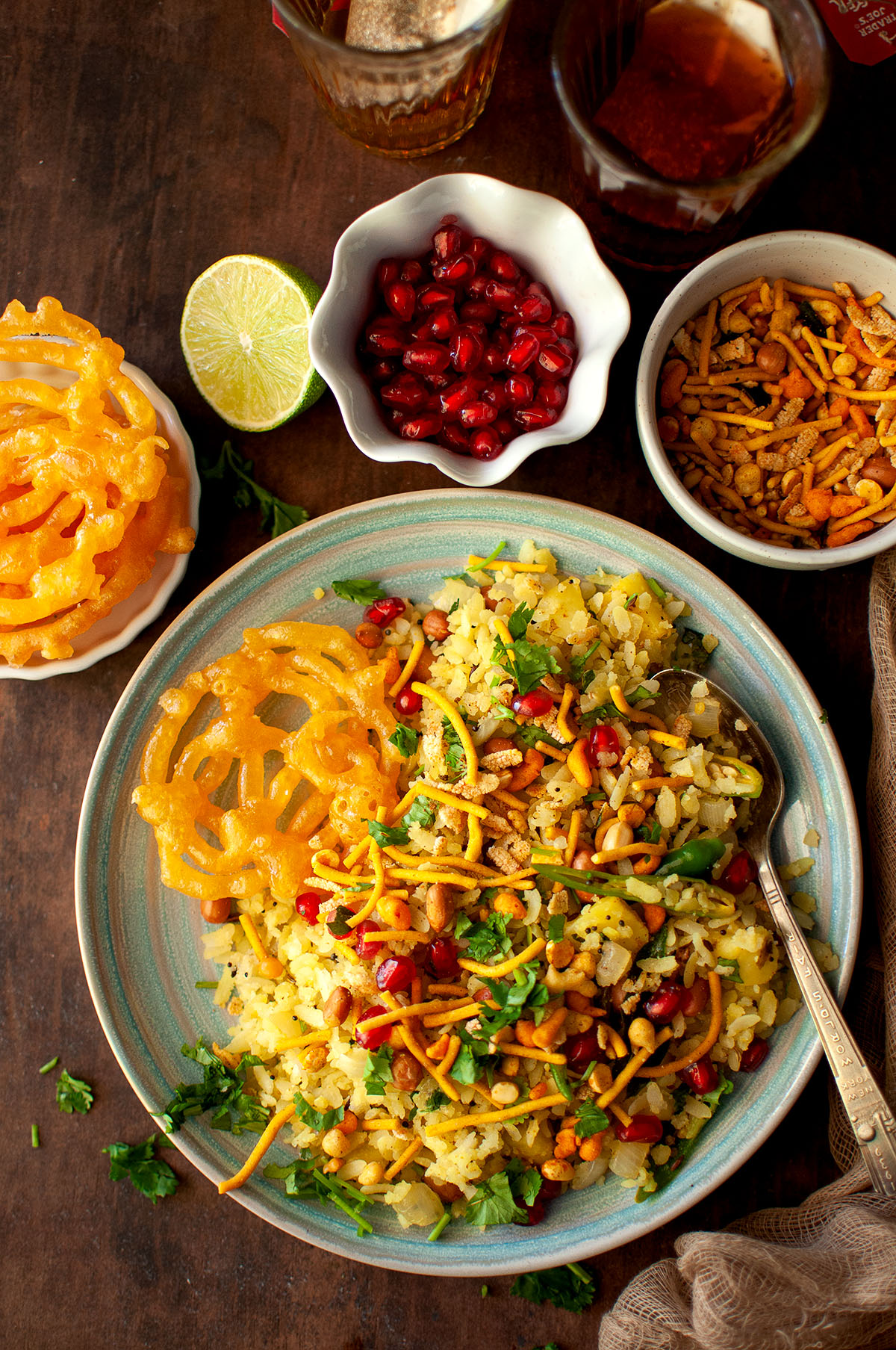 Black plate with Indori poha with jalebi.