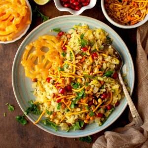 Top view of blue plate with flattened rice upma.