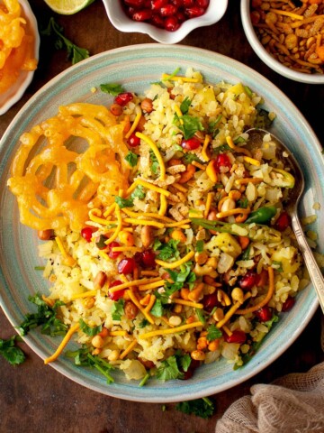 Top view of blue plate with flattened rice upma.