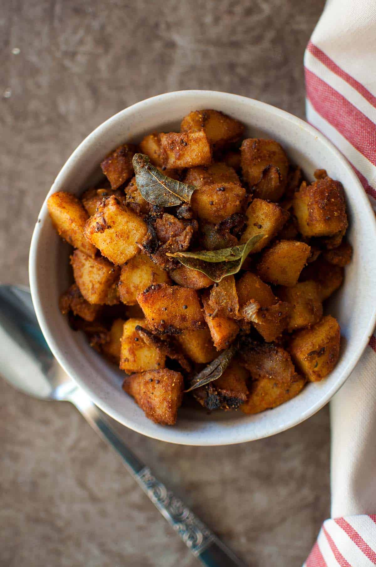 White bowl with spicy potato fry