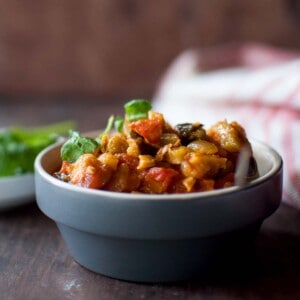 Grey bowl with kakarakaya tomato curry