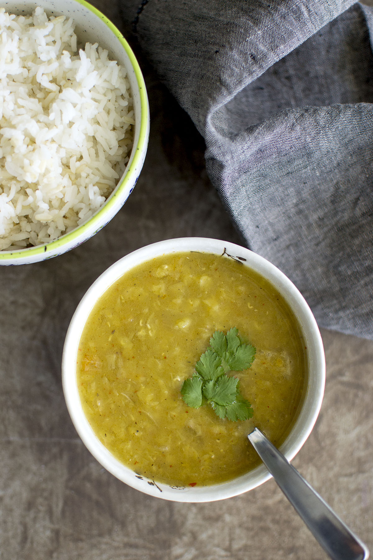 White bowl with Nepali dal served with rice