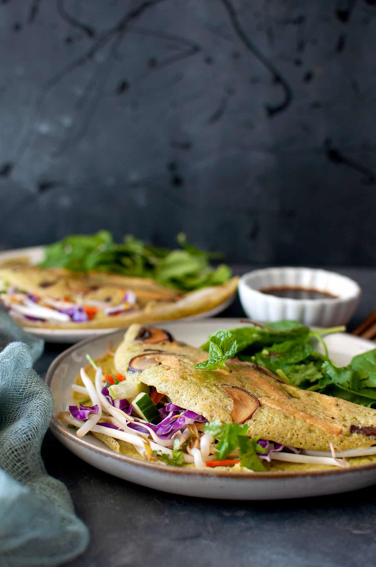 Grey plate with mung bean pancakes.