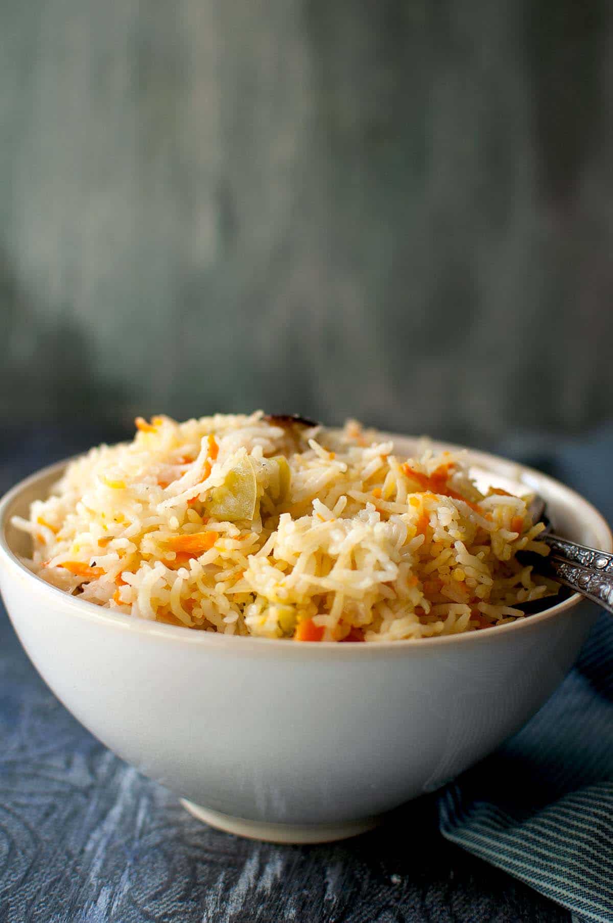 White bowl with Yemeni rice with carrot