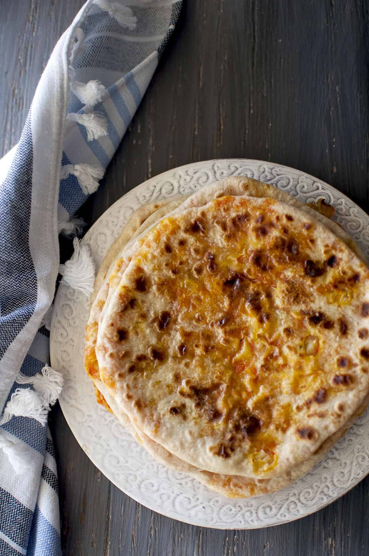 Grey plate with carrot stuffed flatbread