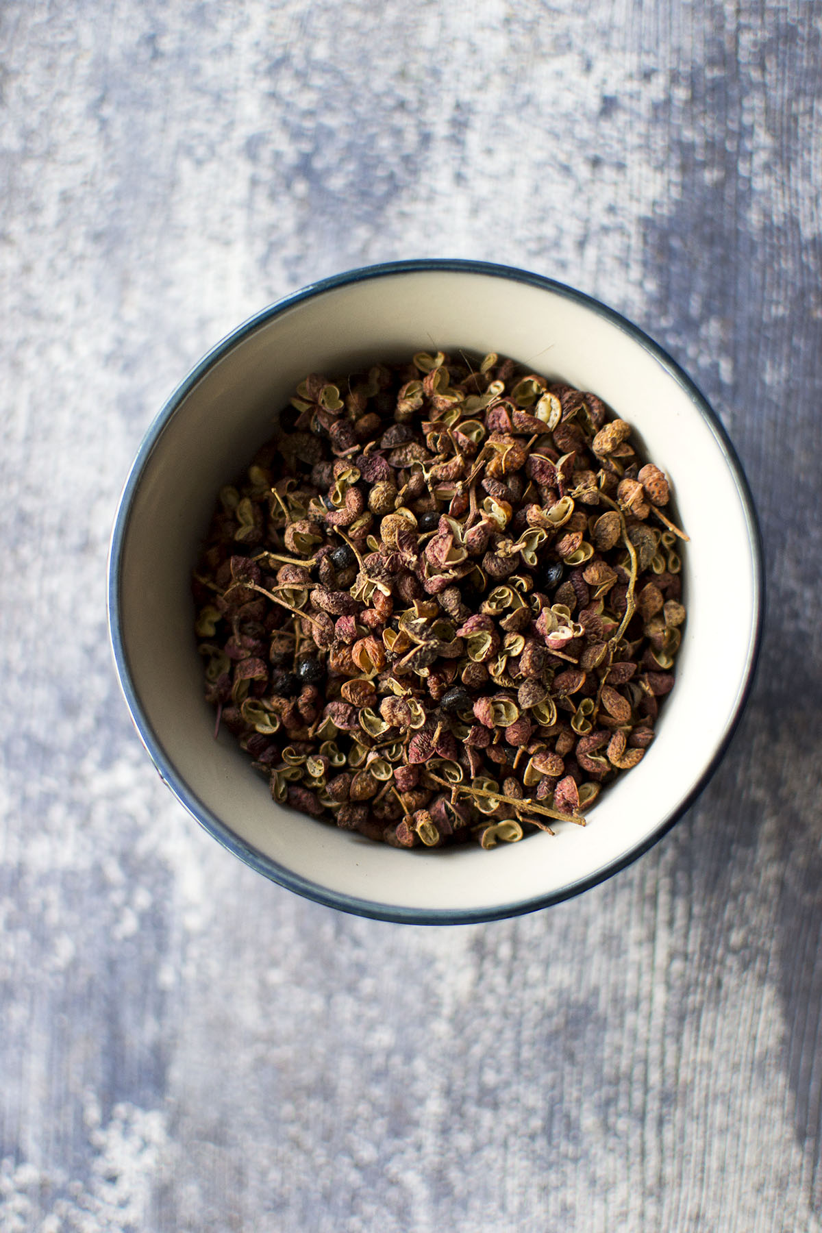 White bowl with Sichuan peppercorns