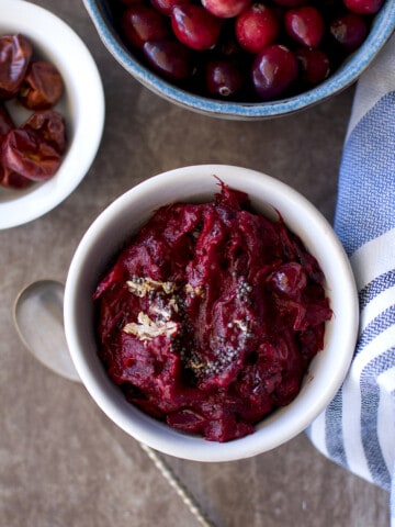 Top view of a white bowl with cranberry pachadi