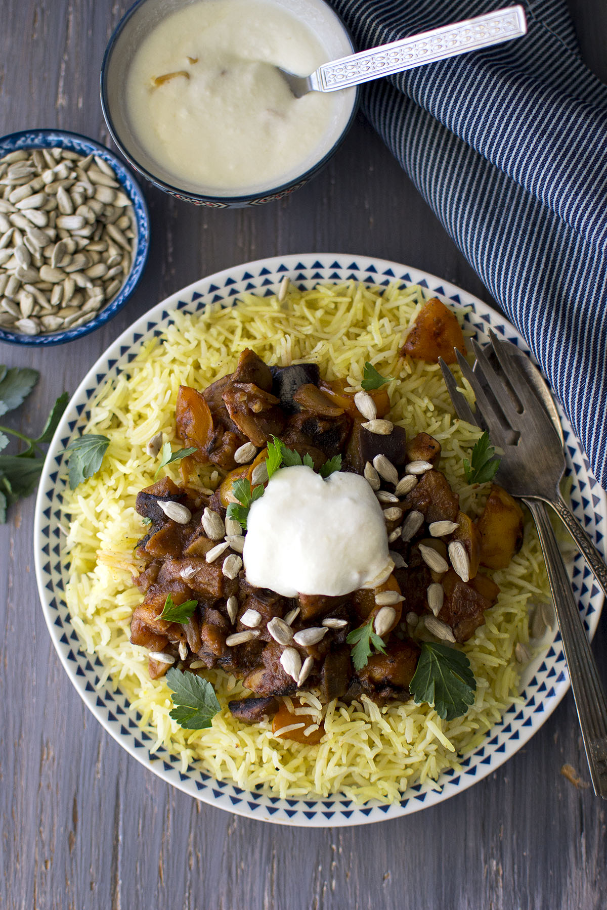 White late with Jordanian Rice Pilaf with vegetables and yogurt sauce on top