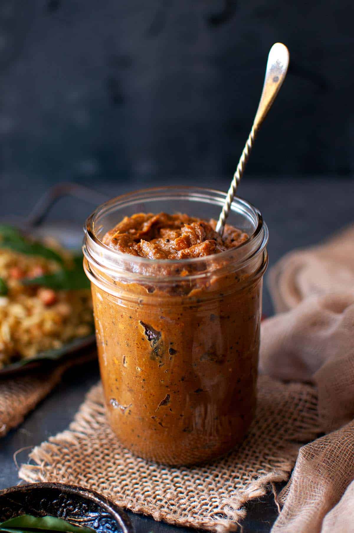 Mason jar with spicy tamarind chutney.