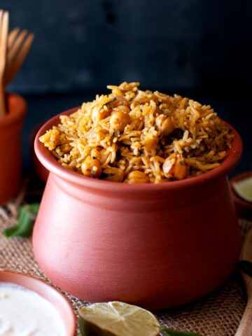 Terracotta bowl with instant pot cickpea fenugreek rice.