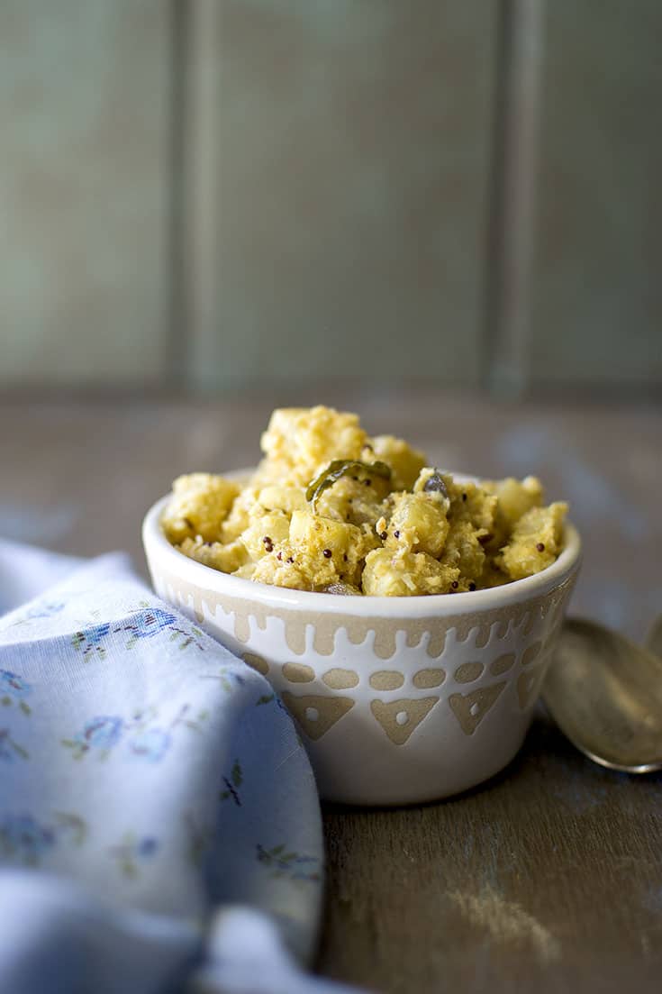 White bowl with bottle gourd curry in coconut gravy