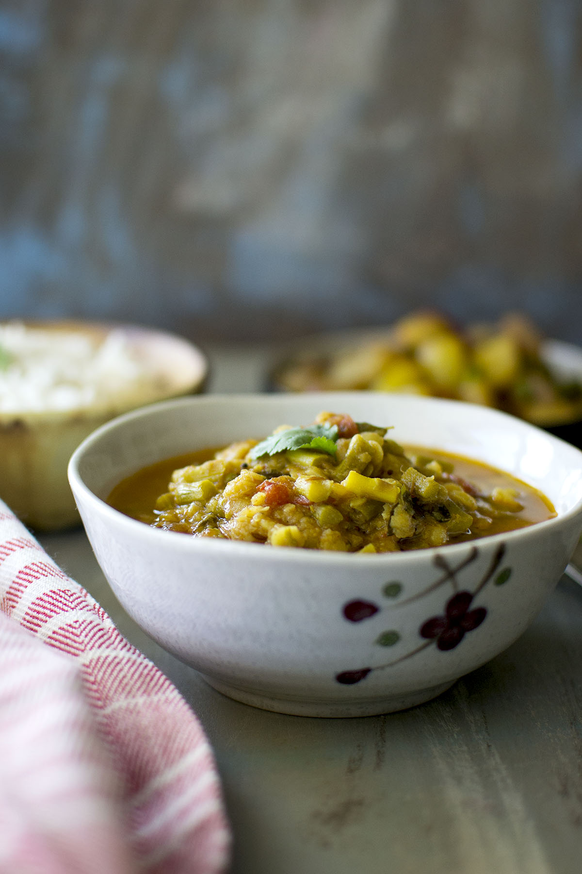 Grey bowl with asparagus lentil soup