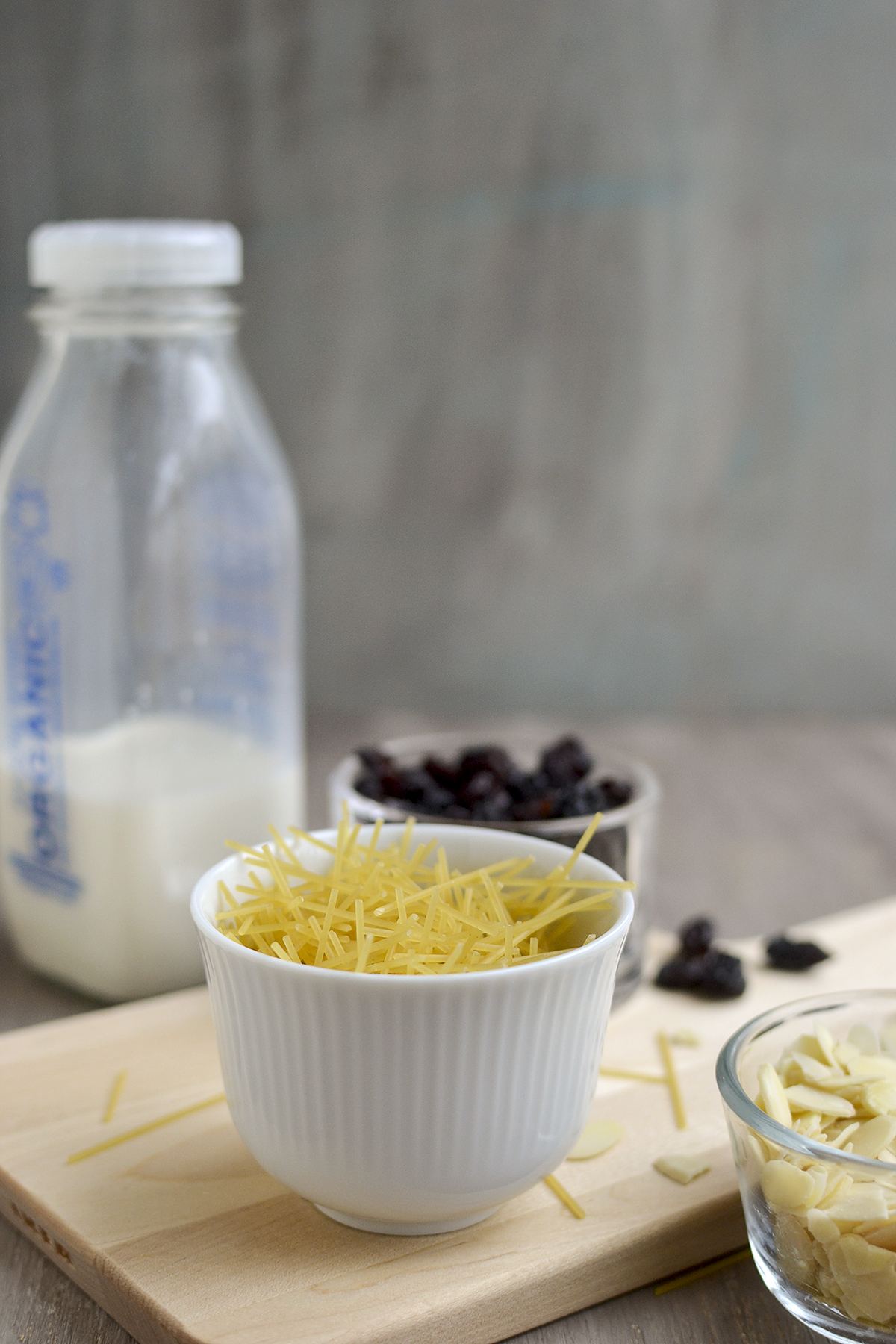 Ingredients for the recipe - broken noodles, milk, raisins and nuts