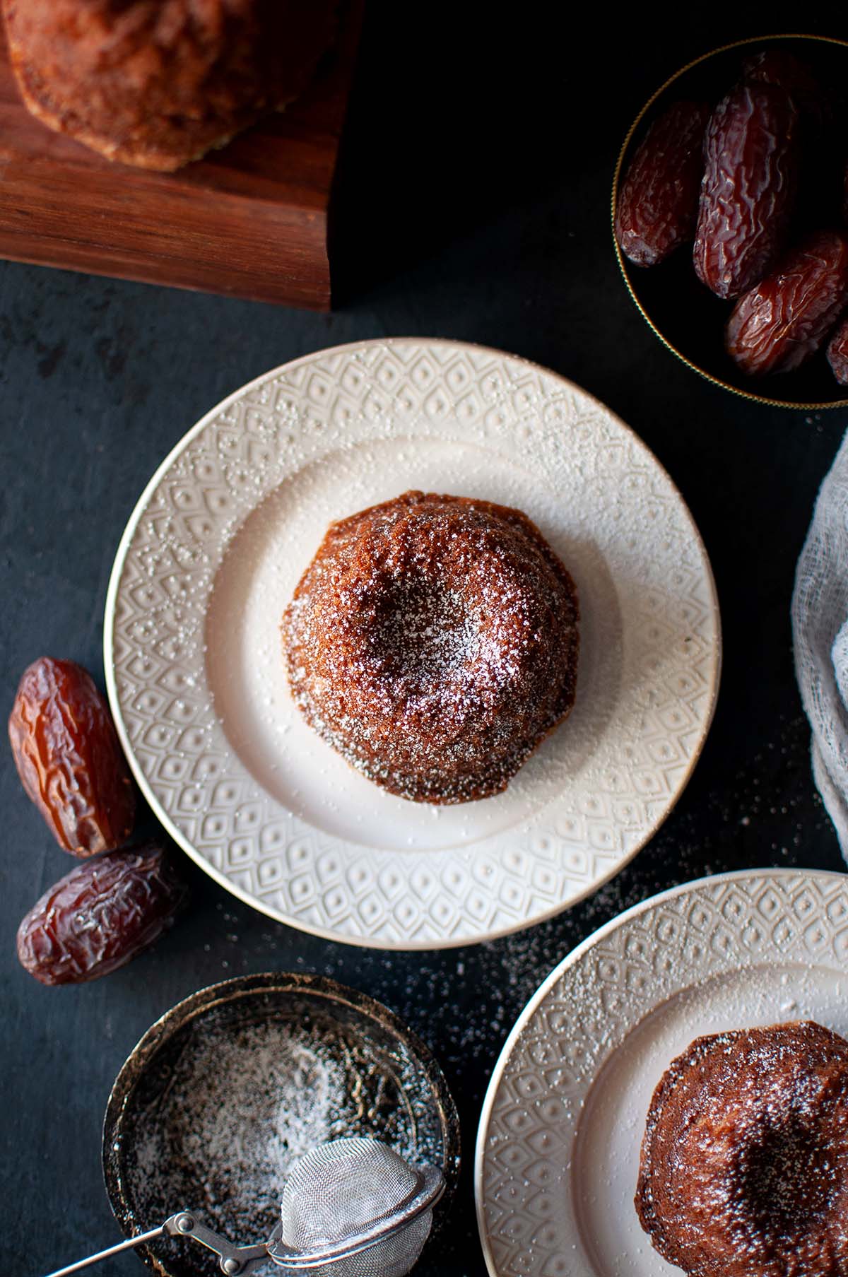 Top view of a white plate with mini bundt cake.