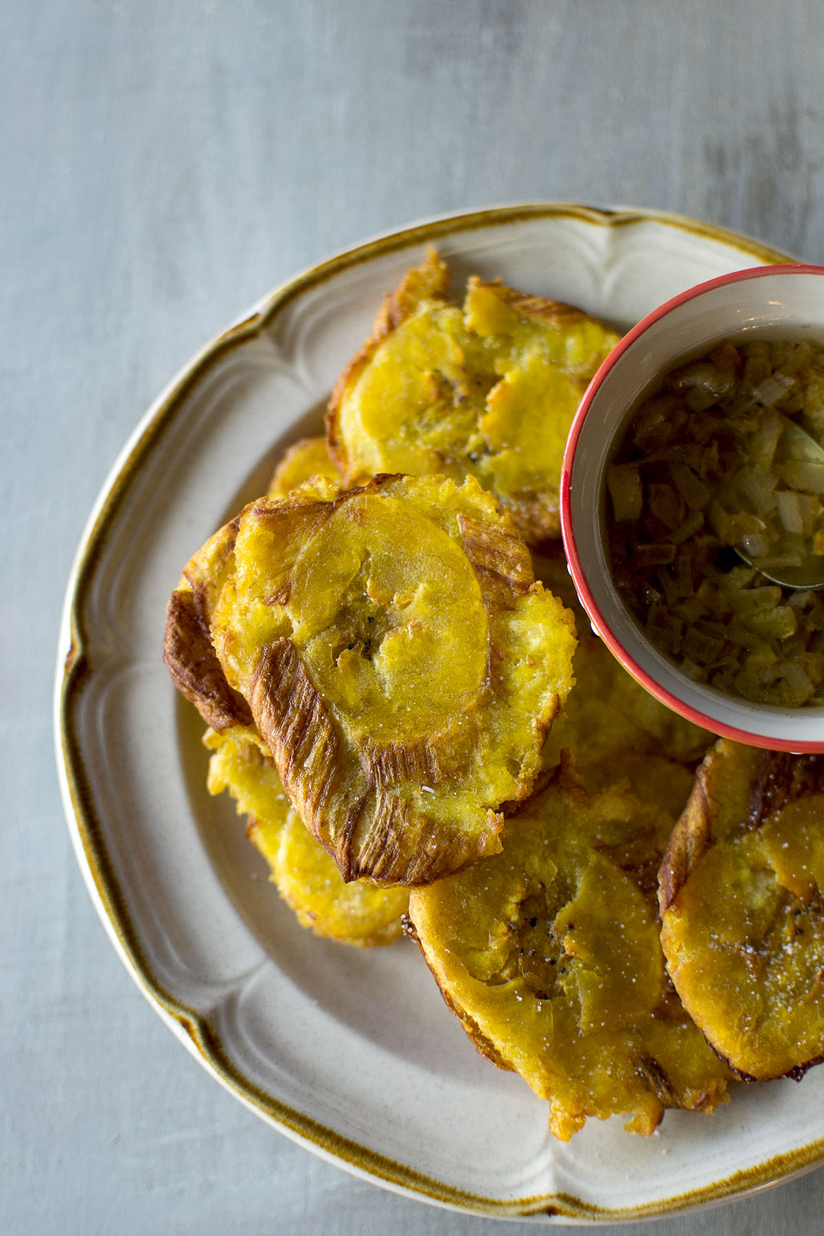 Top view of plate with crispy Cuban tostones.