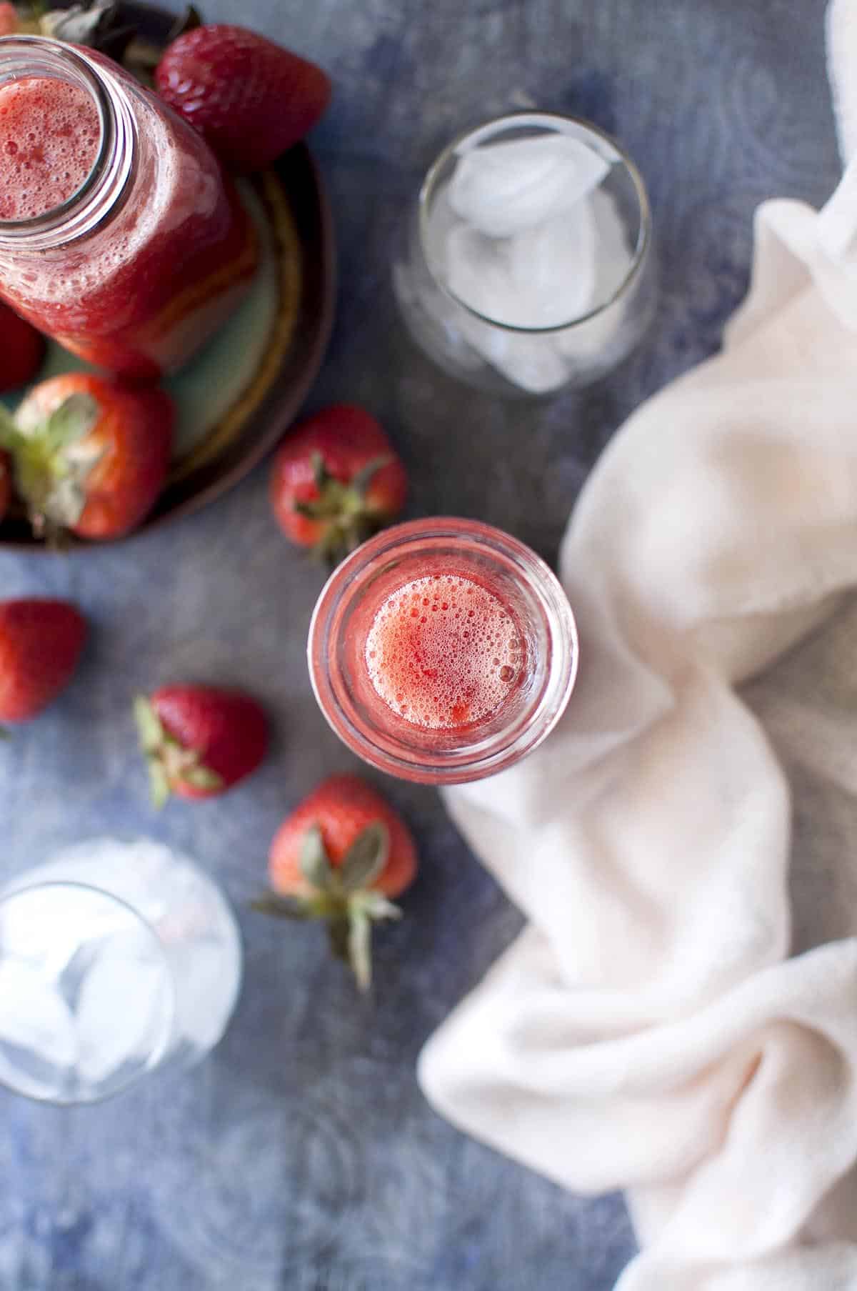 top view of a glass jar with strawberry concentrate