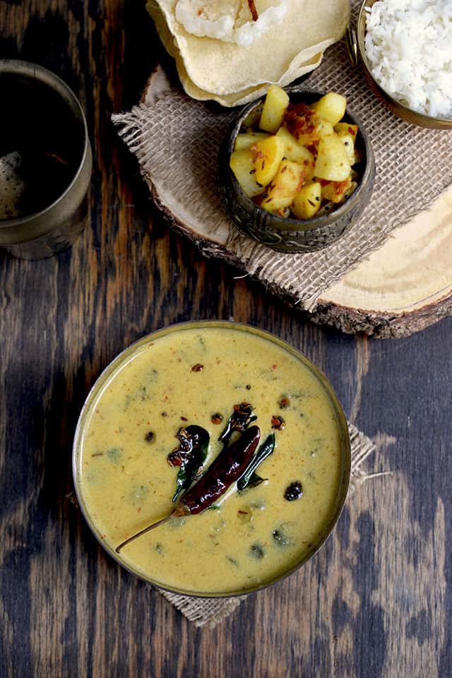 Bowl of Tamil Nadu Buttermilk Stew with Sauteed potatoes and rice