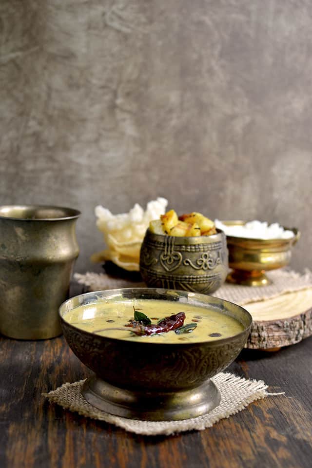 Bowl of Mor Kuzhambu with Potato Curry and Rice