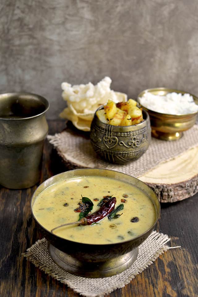 Bowl of Tamil Nadu Buttermilk Stew with Sauteed potatoes and rice