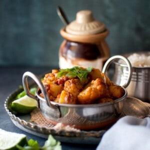 Steel bowl with cauliflower potato curry