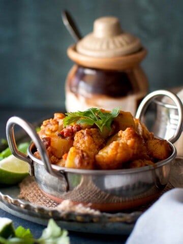 Steel bowl with cauliflower potato curry