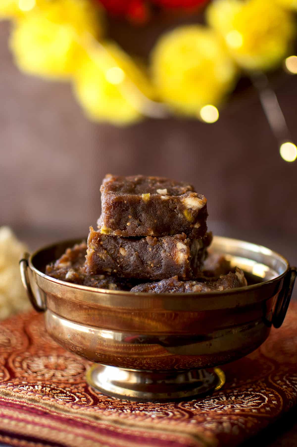 Golden bowl with a stack of Date Nut Bars