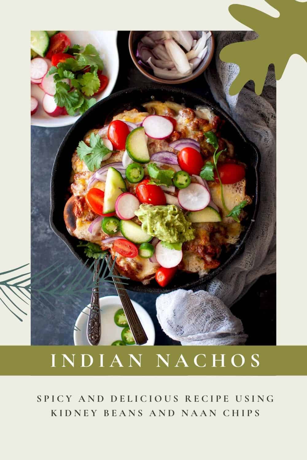 Cast iron skillet with Indian nachos topped with fresh veggies.