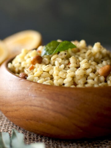 Wooden bowl with Barley Pulihora