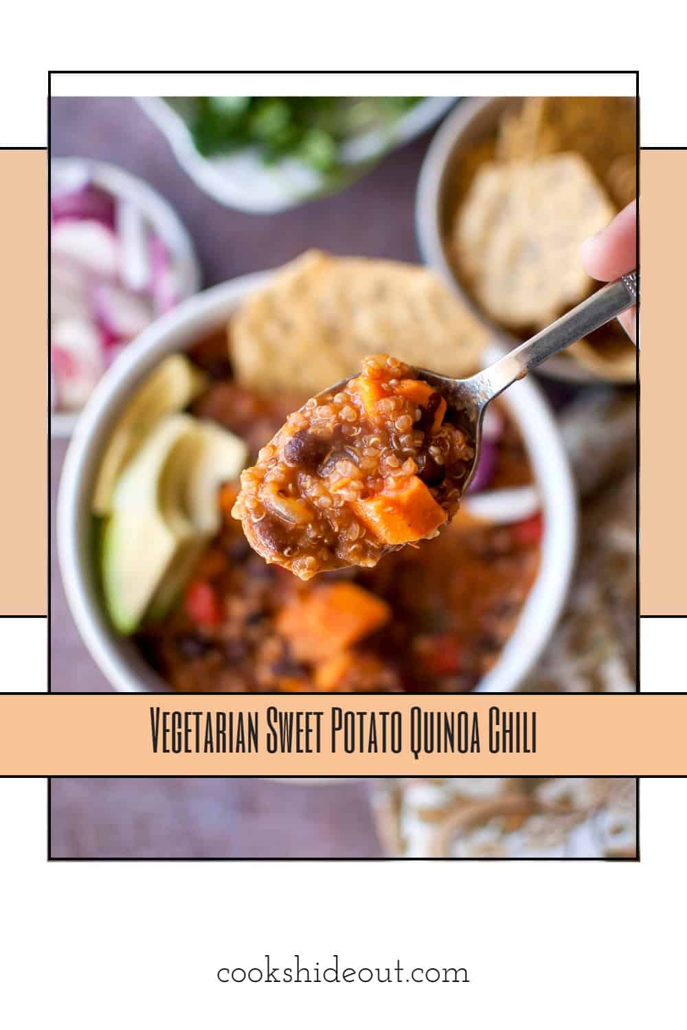 Hand holding sweet potato quinoa chili