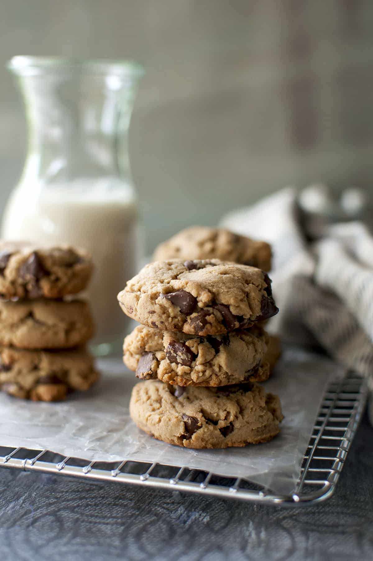 wire rack with stacks of whole wheat chocolate chip cookies