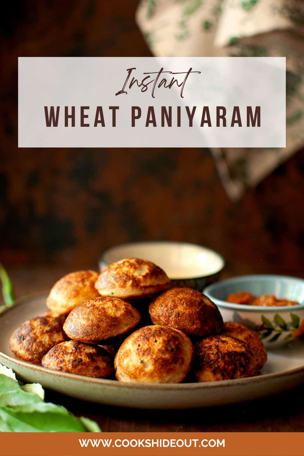 Grey plate with a stack of wheat paniyaram.