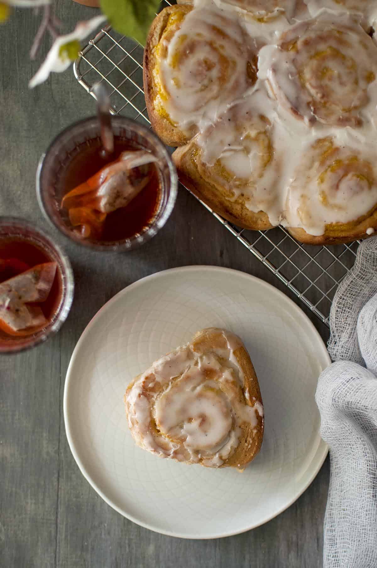 Top view of a white plate with mango sweet roll