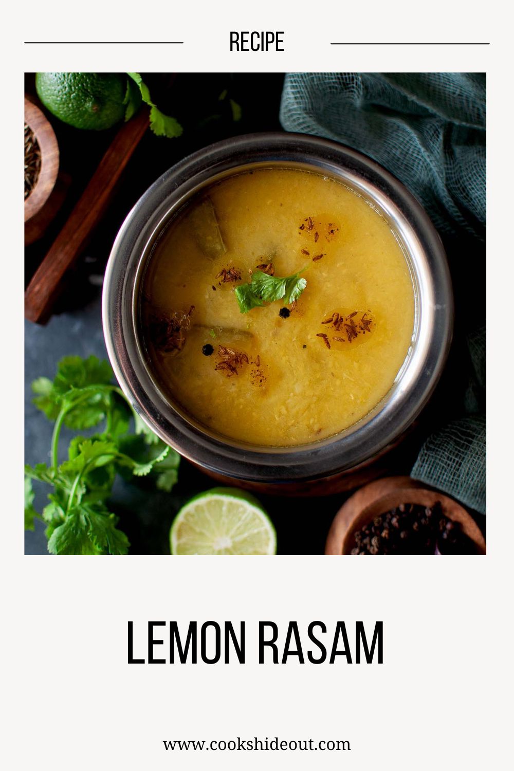 Top view of a steel bowl with lemon rasam.