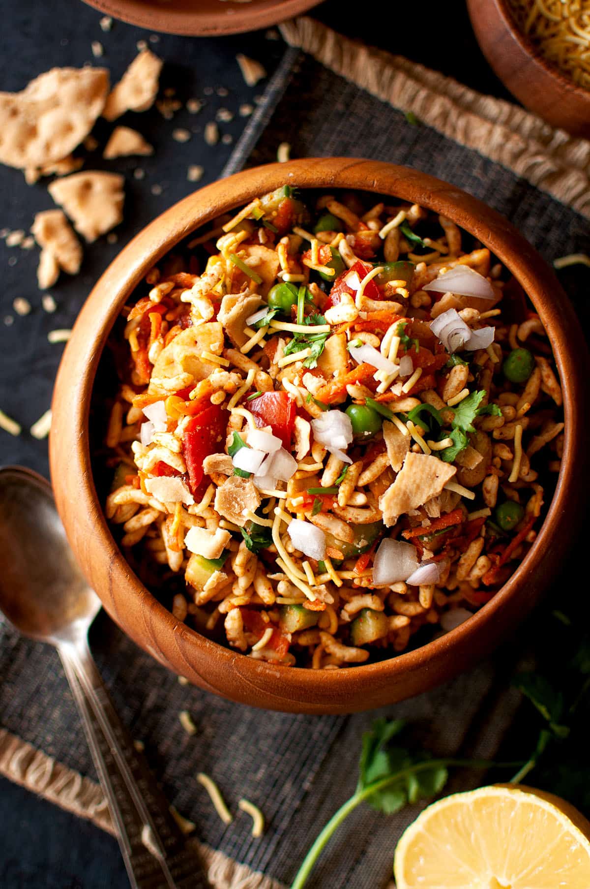 Wooden bowl with veggie murmure chaat.