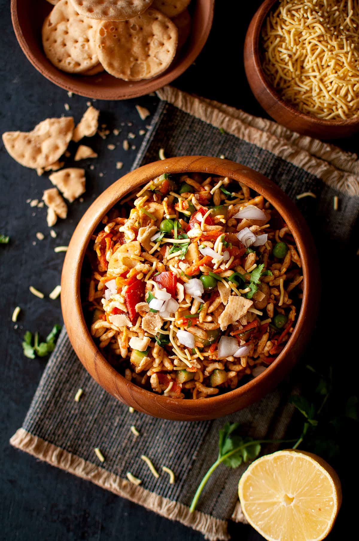 Wooden bowl of vegetable bhelpuri.