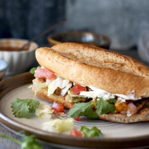 Grey plate with vegetarian torta sandwich