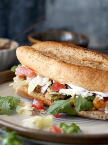 Grey plate with vegetarian torta sandwich