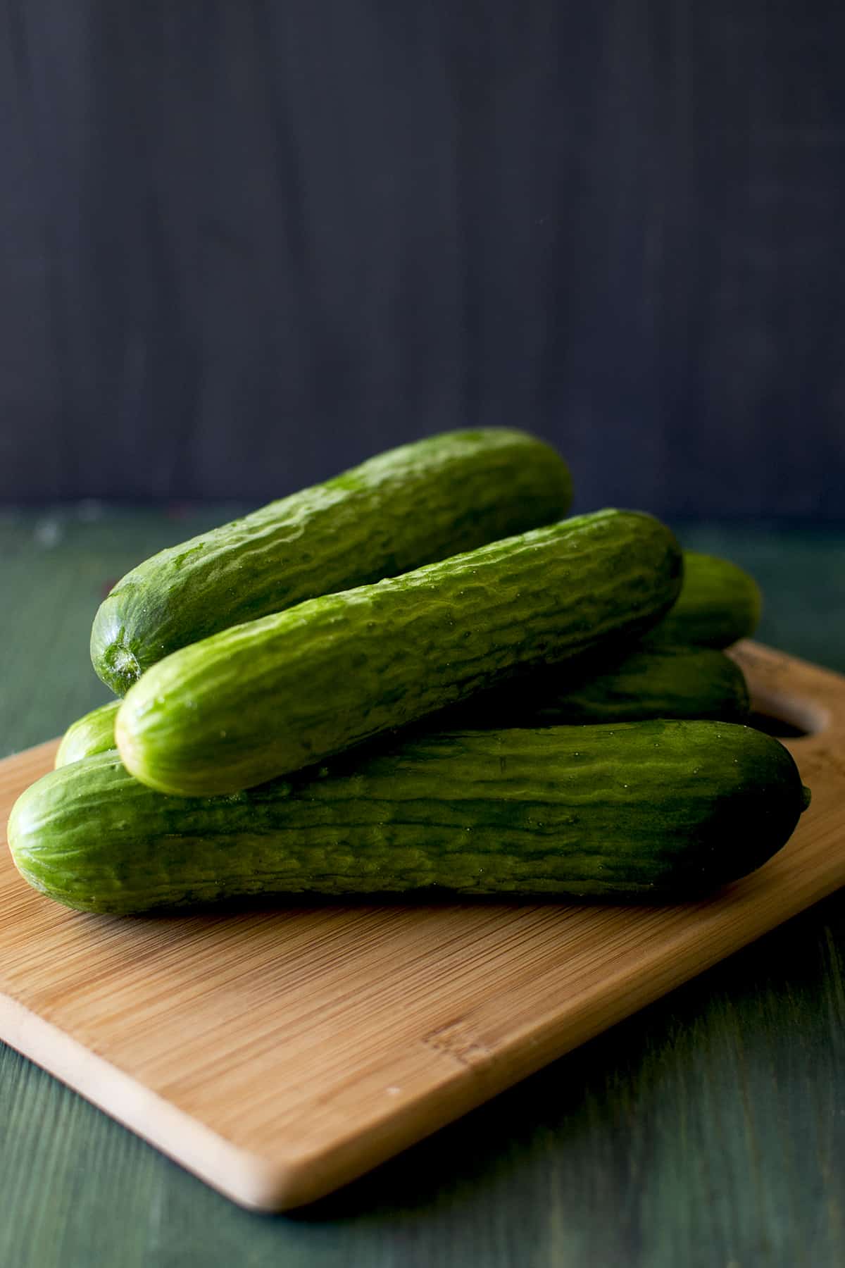 chopping board with fresh Persian cukes