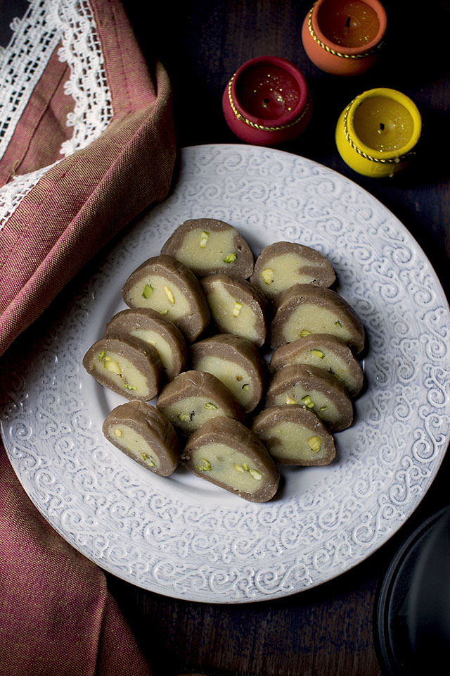 Plate of chocolate and pistachio rolls for Diwali