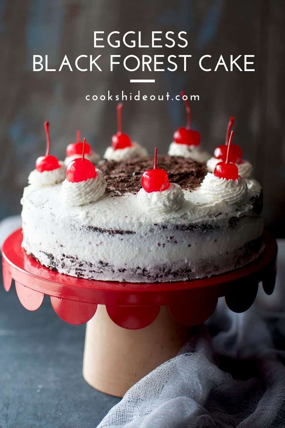 Red cake stand with black forest cake