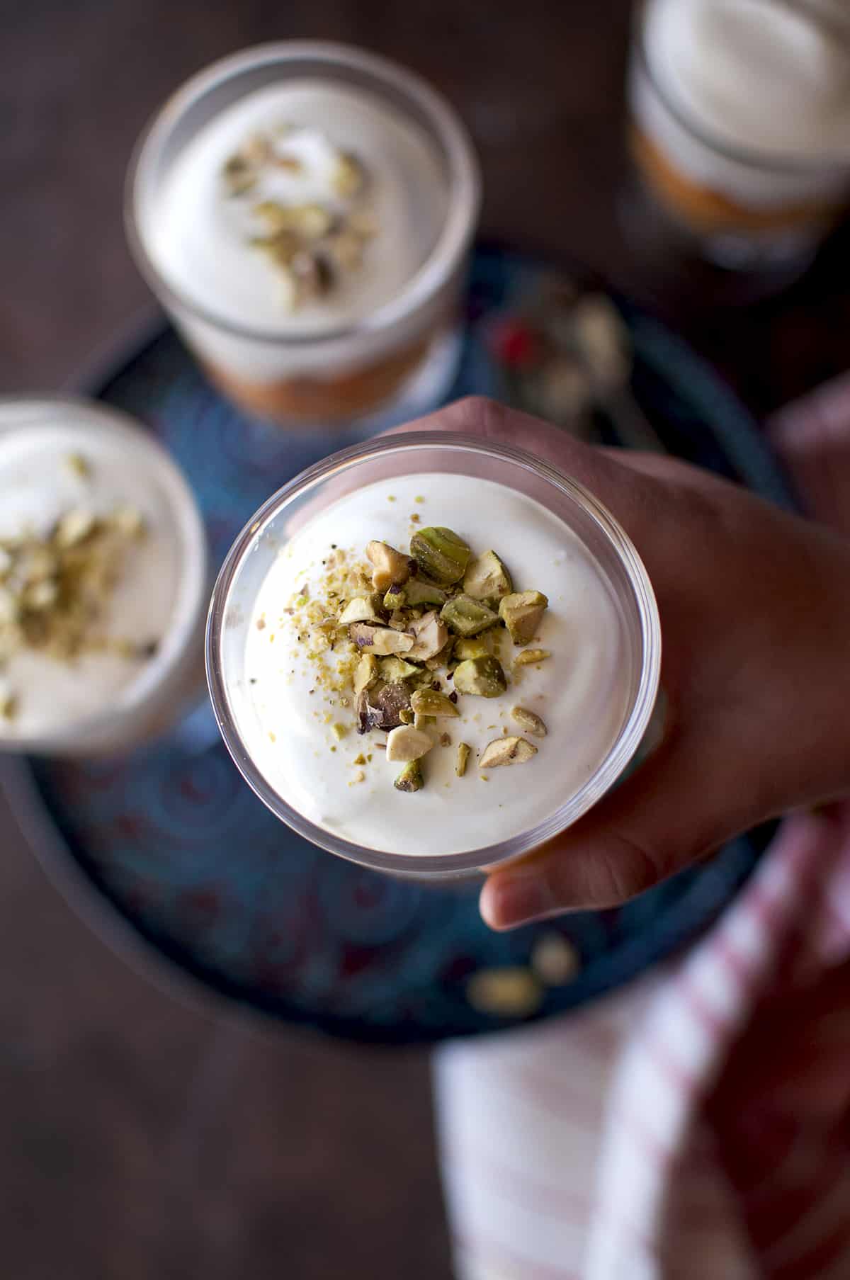 Top view of pistachio topped creamy cheesecake.