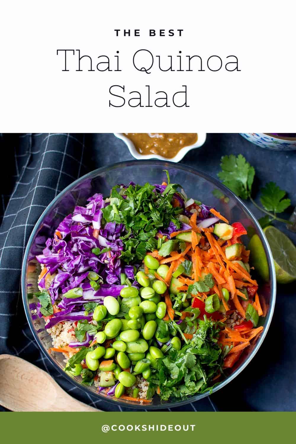 Top view of a glass bowl with veggies and quinoa and a small white bowl with dressing