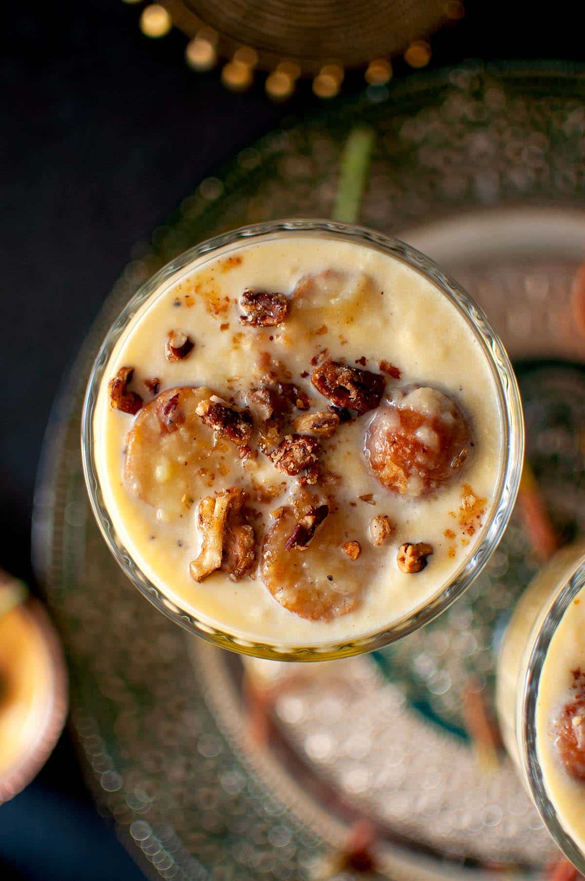 Top view of custard gulab jamun with praline