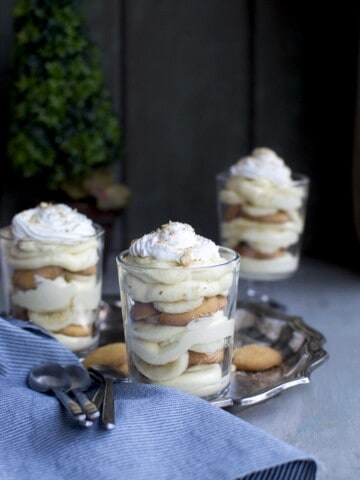 glass with layers of pudding, banana and vanilla wafers
