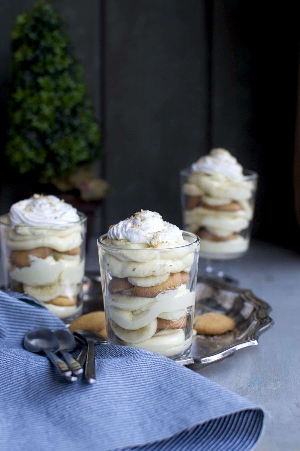 glass with layers of pudding, banana and vanilla wafers