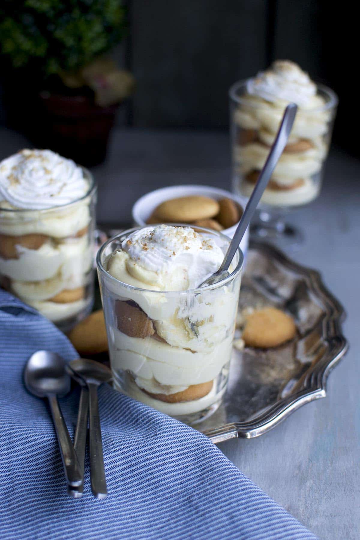 Silver plate with individual banana pudding in a cup