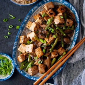 Blue platter with Tofu asparagus stir fry.