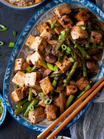 Blue platter with Tofu asparagus stir fry.