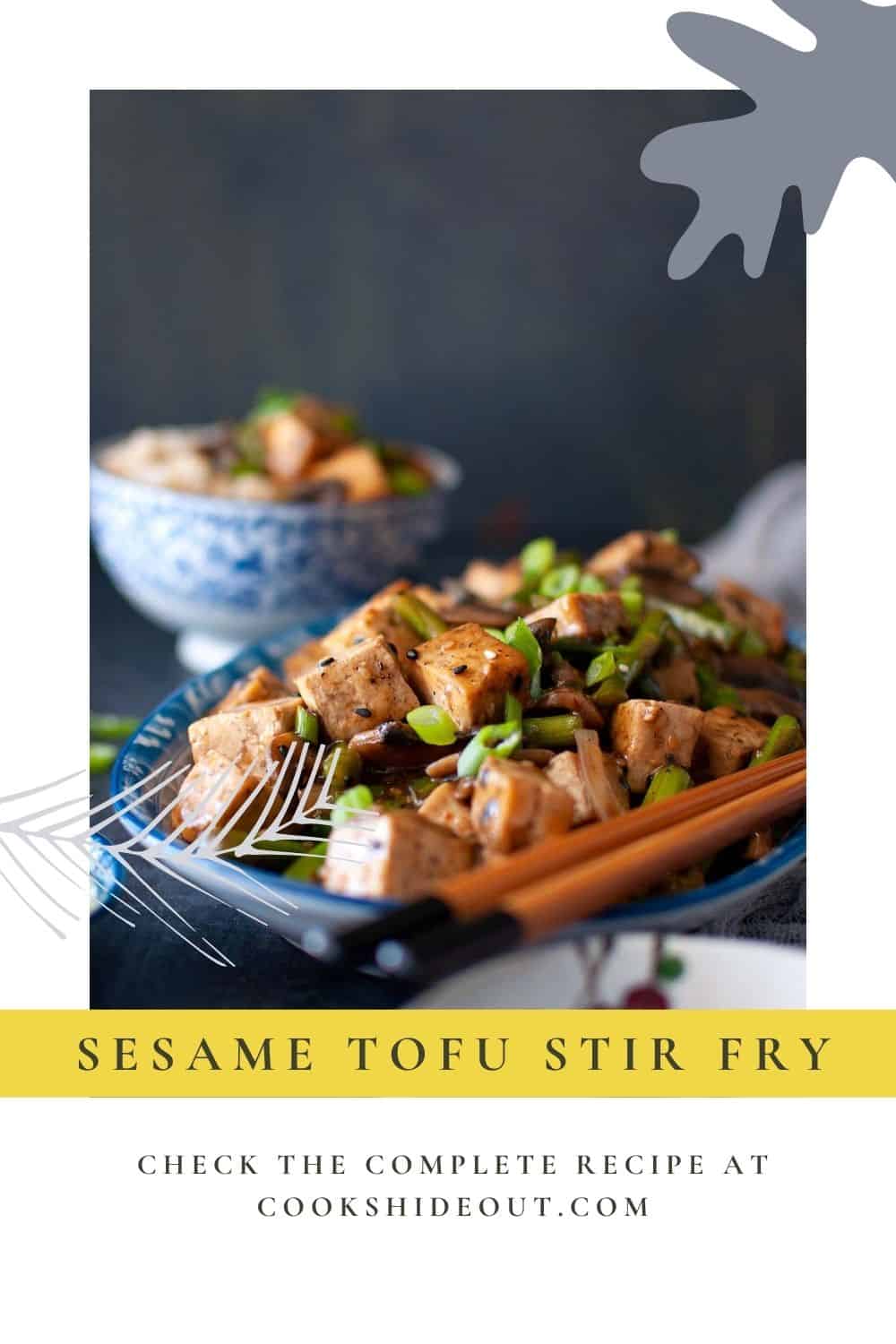 Blue plate with crispy sesame tofu stir fry.